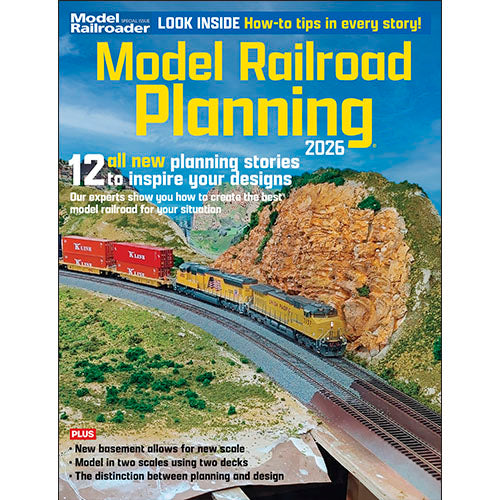 Model Railroad Planning magazine cover with a train on tracks and mountainous background