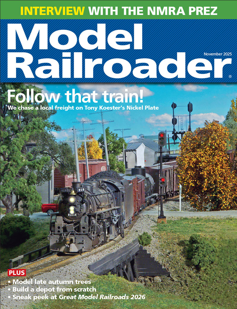 Model Railroader magazine cover with a model train scene and text about an interview and features.