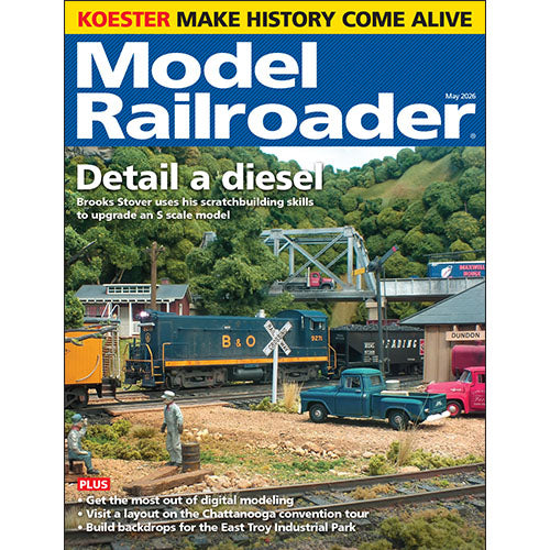 Model Railroader magazine cover with model train set and text