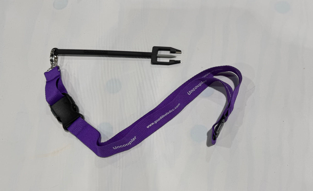 Purple lanyard with a black metal clip on a light gray background