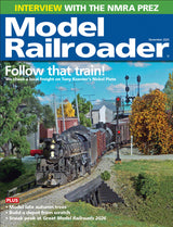 Model Railroader magazine cover with a model train scene and text about an interview and features.