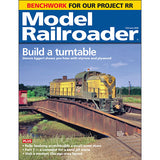 Model Railroader magazine cover with a yellow train on a bridge